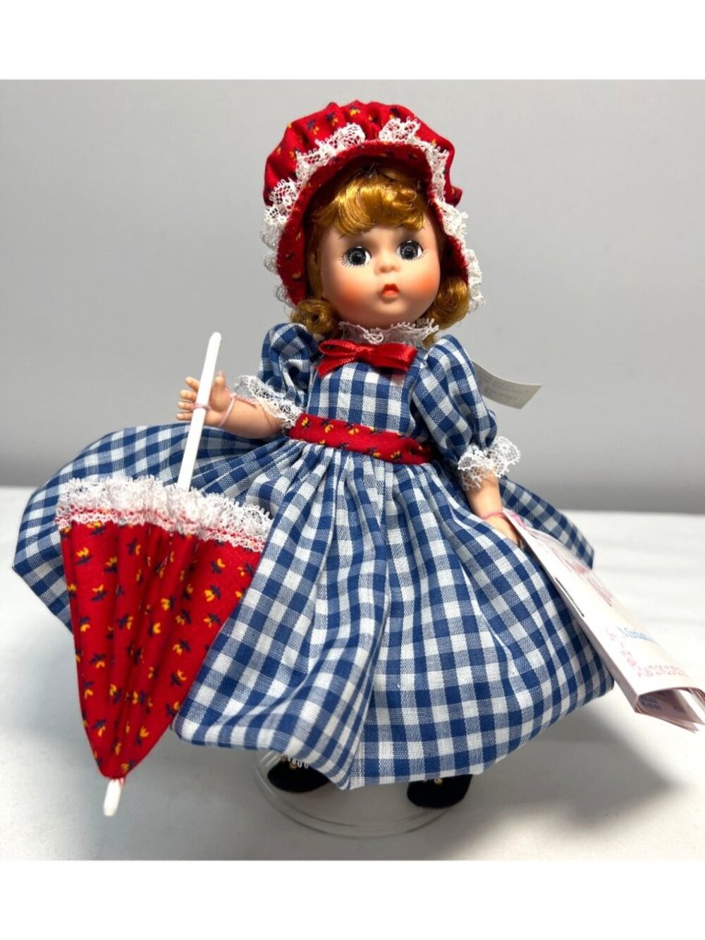 Madame Alexander Miniature Showcase Doll With Parasol & Red Bonnet, Signed Stand